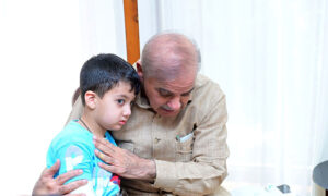 Prime Minister Muhammad Shehbaz Sharif interacts with the children of Customs Inspector Shaheed Husnain Ali Tirmazi.