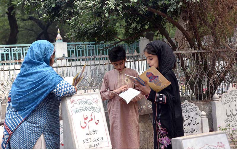 Vendors displaying flowers as a large number of people visit graveyards on Eidul Fitr to offer Fateha on graves of their family members