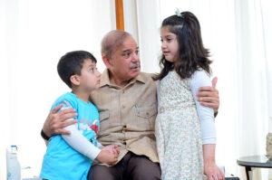 Prime Minister Muhammad Shehbaz Sharif interacts with the children of Customs Inspector Shaheed Husnain Ali Tirmazi.