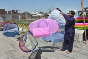 A roadside vendor displays mosquito nets to attract the customers.