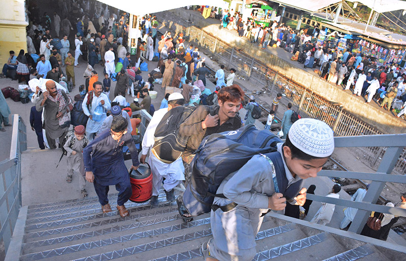 Children waving hands after getting board on Eid Special Train at Cantt Railway Station, departing to their home towns for celebrating Eidul Fitr, festive