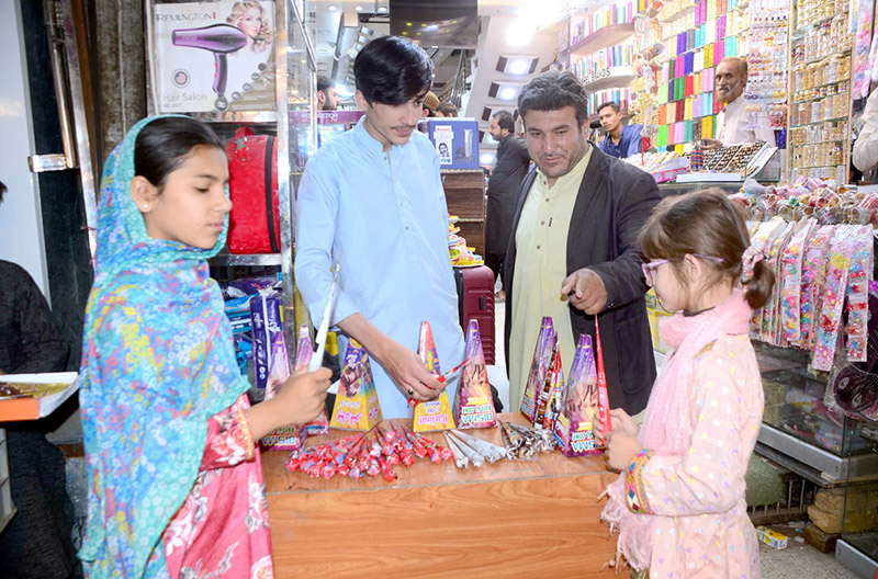 Vendor decorating colorful bangles to attract customers at Churi streets ahead of Eidul Fitr