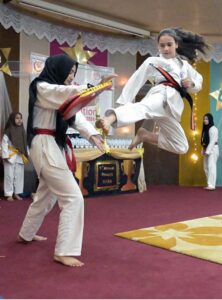 Students showing their skills in Taekwondo during Annual Prize Distribution Ceremony of Khabib Girls School and College.