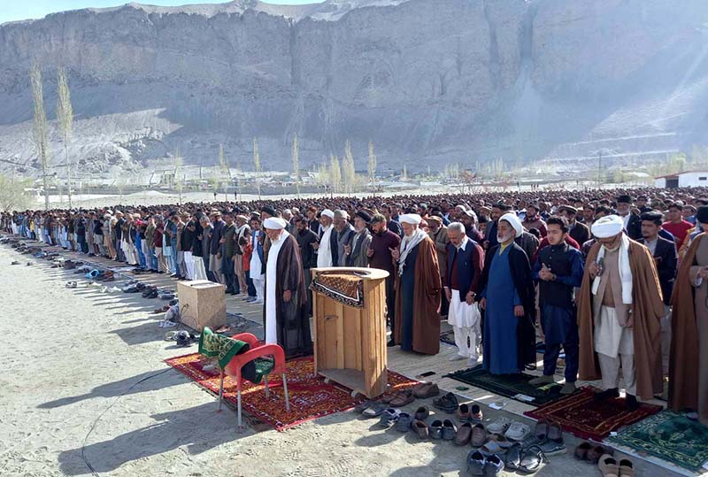 A large number of faithful offering dua after Eid-ul-Fitr prayer at Eidgah Ground