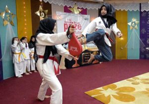 Students showing their skills in Taekwondo during Annual Prize Distribution Ceremony of Khabib Girls School and College.