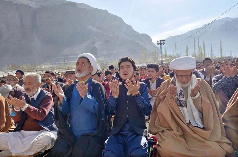 A large number of faithful offering dua after Eid-ul-Fitr prayer at Eidgah Ground