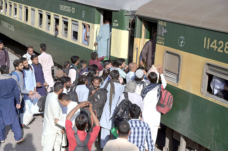 A large number of people getting board on Train at Railway Station departing to their home towns to celebrate Eidul Fitr festive with their loved ones
