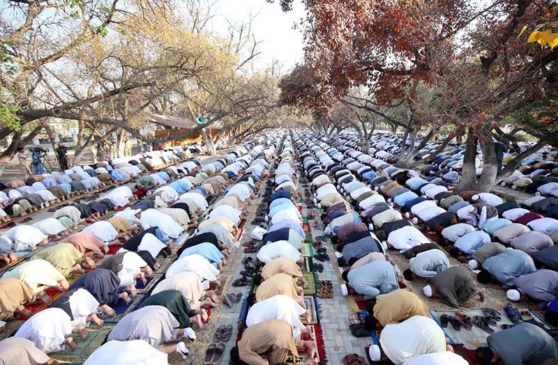 A large number of faithful offering Eid-ul-Fitr prayer at Eidgah Ground