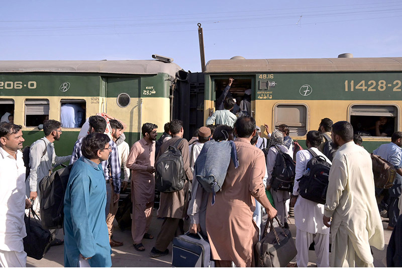 A large number of people getting board on Train at Railway Station departing to their home towns to celebrate Eidul Fitr festive with their loved ones