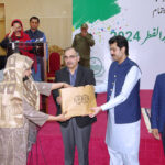 Provincial Minister for Social Welfare and Bait-ul-Mal, Sohail Shaukat Butt, distributes Eid gifts among the staff of the Social Welfare Department