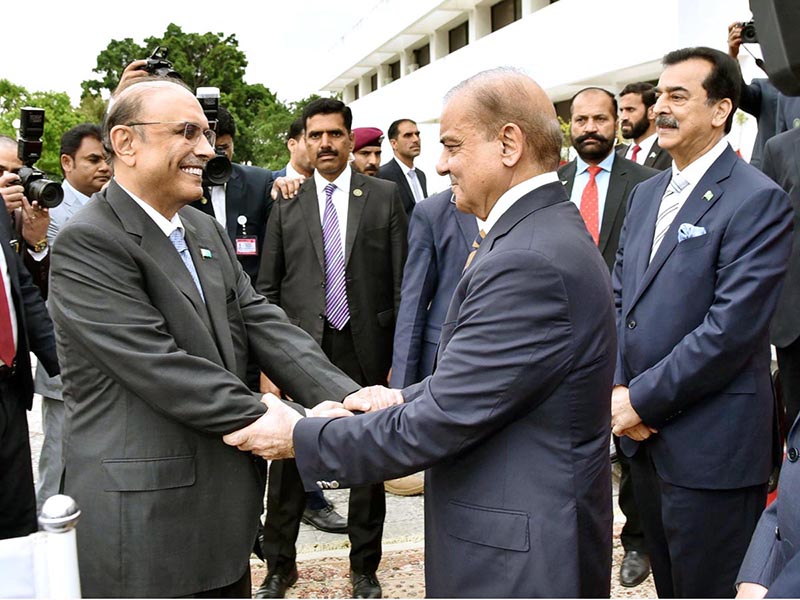 President Asif Ali Zardari being received by the Prime Minister of Pakistan Muhammad Shehbaz Sharif upon his arrival at Parliament House.
