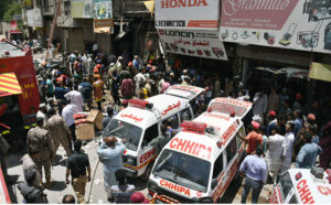 Rescue workers and volunteers are actively engaged in rescue efforts following a gas cylinder explosion at Generator Market.