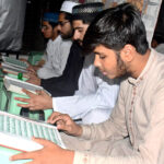 Youngster reciting the Holy Quran in a Jamia Masjid during the holy fasting month of Ramzan