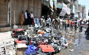 Rescue workers and volunteers are actively engaged in rescue efforts following a gas cylinder explosion at Generator Market.