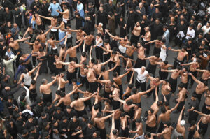 Shiite Muslim mourners take part in a procession to commemorate the death anniversary of Prophet Mohammad's (PBUH) companion and son-in-law Imam Ali (AS) during the Islamic month of Ramadan.