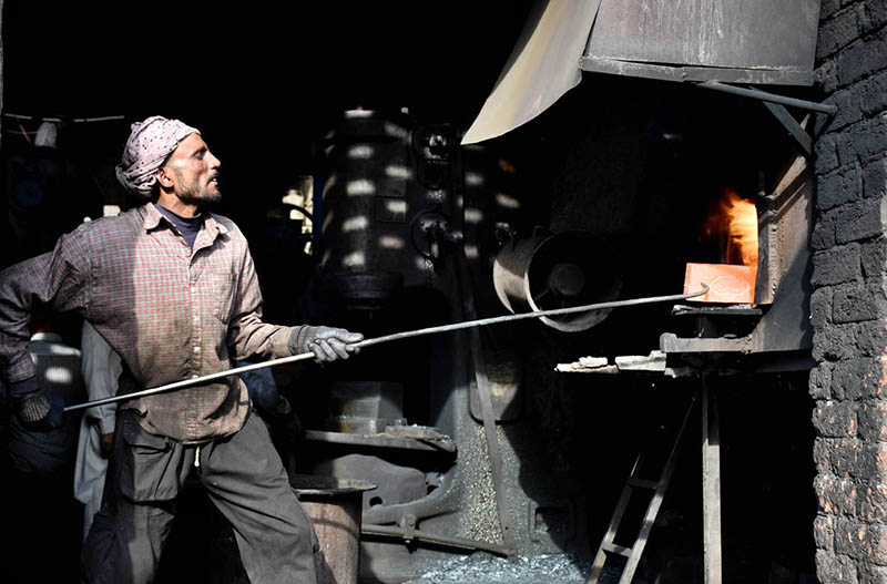 A labourer busy in preparing Iron made things at their workplace as the world marks International Labour Day. May 1st, International Workers' Day, commemorates the historic struggle of working people throughout the world. In 1884, the Federation of Organized Trades and Labour Unions passed a resolution stating that eight hours would constitute a legal day's work from and after May 1, 1886.