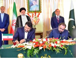 Federal Minister for Overseas Pakistanis and Human Resources Development Chaudhry Salik Hussain shaking hand with his counterpart after signing MOU between the Ministry of Cooperatives, Labour and Social Welfare of Iran and the Ministry of Overseas Pakistanis and Human Resource Development of Pakistan.