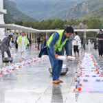 Volunteers arranging food items during Iftar for people in fast at Faisal Masjid in the federal capital