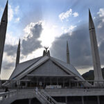 Dark clouds hovering over the Faisal Masjid before light rain in the federal capital