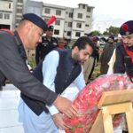 Balochistan Home Minister, Mir Zia Langove laying wreath of flower on graveyard of martyrs
