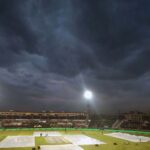 A view of the Pindi Cricket Stadium while in the background dark clouds hovering over the city