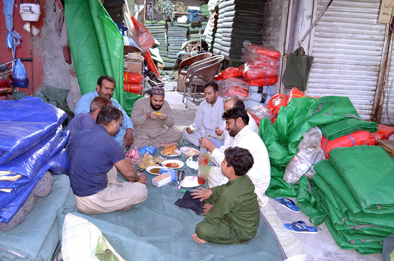 Workers breaking fast at their work place in the Islamic fasting month of Ramadan