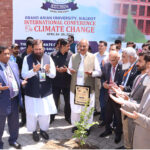 Governor Punjab Balighur Rehman offering Dua after tree planting on the occasion of International Conference on Climate Change at Grand Asian University