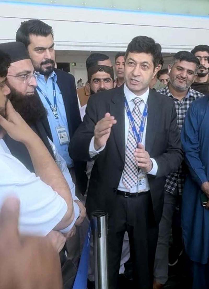 Hussain Muhammad, Consul General along with his team meet stranded Pakistani passengers at Dubai International Airport.