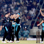 New Zealand players celebrate the wicket of Pakistan batter Usman Khan (caught by Duffy balled by Sears) during the Fourth Twenty20 International Cricket Match between Pakistan and New Zealand at the Qaddafi Cricket Stadium