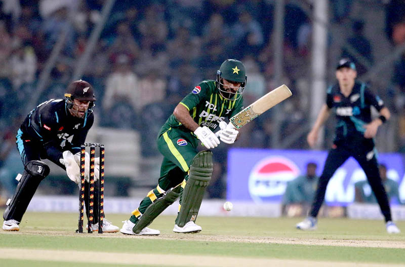 New Zealand players celebrate the wicket of Pakistan batter Usman Khan (caught by Duffy balled by Sears) during the Fourth Twenty20 International Cricket Match between Pakistan and New Zealand at the Qaddafi Cricket Stadium