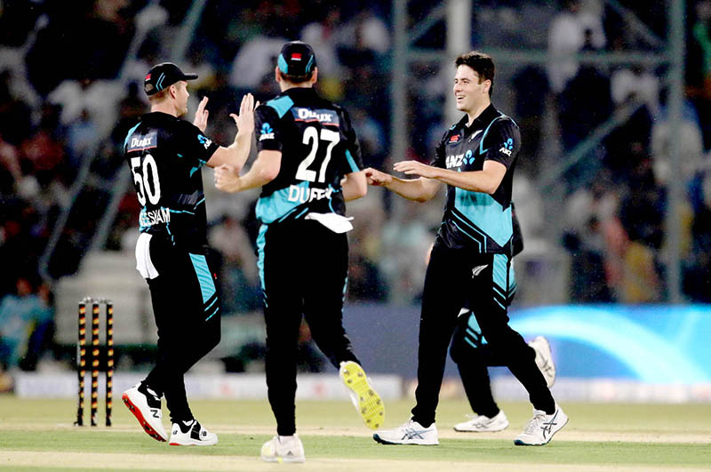 New Zealand players celebrate the wicket of Pakistan batter Usman Khan (caught by Duffy balled by Sears) during the Fourth Twenty20 International Cricket Match between Pakistan and New Zealand at the Qaddafi Cricket Stadium