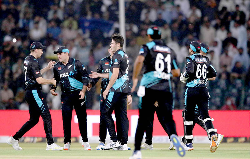 New Zealand players celebrate the wicket of Pakistan batter Usman Khan (caught by Duffy balled by Sears) during the Fourth Twenty20 International Cricket Match between Pakistan and New Zealand at the Qaddafi Cricket Stadium