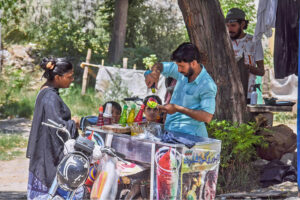 A street vendor preparing traditional ice ball to serve customers at G-6