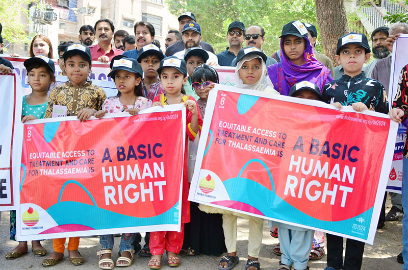 People from different organizations with children patients of Thalassemia are participating in a walk on the eve of World Thalassemia Day organized by Fatimid Foundation at Press Club Road.