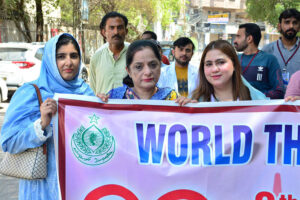 People from different organizations with children patients of Thalassemia are participating in a walk on the eve of World Thalassemia Day organized by Fatimid Foundation at Press Club Road.