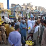 A large number of traders participating in bidding of seasonal fruit Melons at the Fruit market