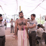 Patrolling police personnel checking the height and chest of youths who have come for recruitment at Police Line