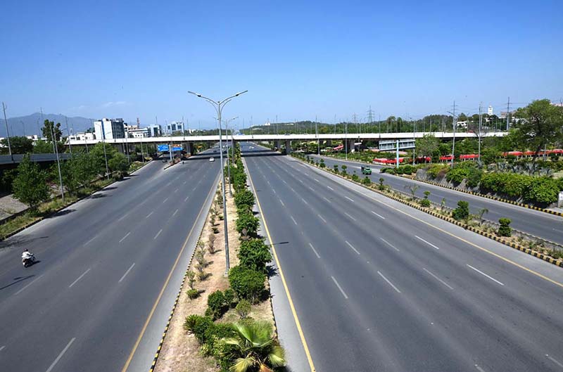 A deserted view of Sri Nagar Highway due to extreme heat wave in Federal Capital