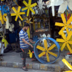 A worker busy in preparing air cooler fan blades at his workplace