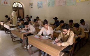 Students solving question paper during annual examination of SSC (part-I) at Naval Rai Hiranand High School