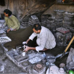 Workers making different parts from iron die at his work place at goods Naka area