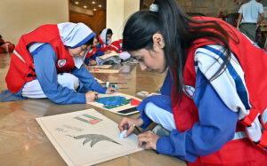 Students participating in Arts & Painting Competition under the theme "Keeping Humanity Alive" in connection with World Red Cross and Red Crescent Week Celebration at Citizen's Club, F-9 Park.