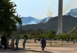 A view of smoke emitting after fire erupts at Margalla Hills in the Federal Capital.