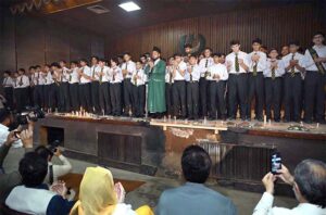 Students of APS observing candle vigil in memory of the victims of May 9 at Radio Pakistan.