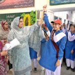 Principal Government Comprehensive Girls High School Robina Kausar announcing results during Student Council Election at Government Comprehensive Girls High School.