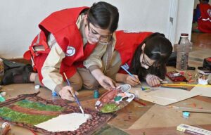 Students participating in Arts & Painting Competition under the theme "Keeping Humanity Alive" in connection with World Red Cross and Red Crescent Week Celebration at Citizen's Club, F-9 Park.