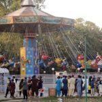 Youngsters enjoy bathing in the swimming pool to get some relief from hot weather in the Provincial Capital