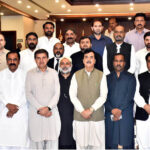 Acting President Syed Yousuf Raza Gillani in a group photo with a delegation of members of the Parliament, Provincial Assembly, and prominent political figures from Multan