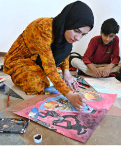Students participating in Arts & Painting Competition under the theme "Keeping Humanity Alive" in connection with World Red Cross and Red Crescent Week Celebration at Citizen's Club, F-9 Park.