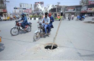 Motorcyclists crossing near the open main hole at Khayyam Chowk may cause any mishap and needs the attention of concerned authorities.